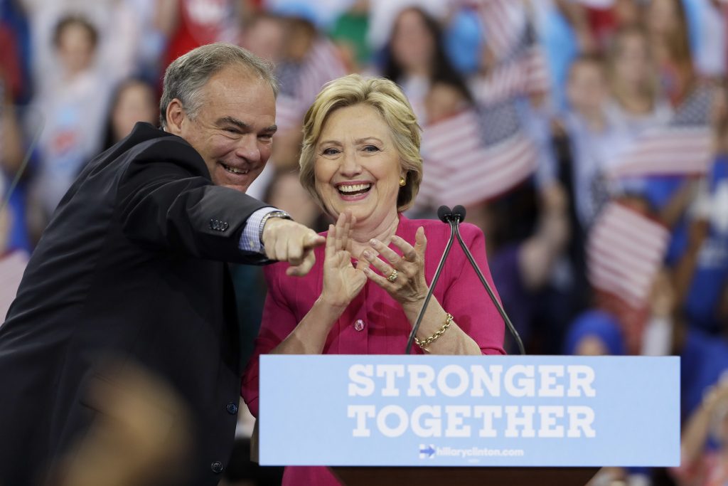 Democratic presidential candidate Hillary Clinton and her running mate, Democratic vice presidential candidate, Sen. Tim Kaine, D-Va., react after a campaign rally at Temple University, Friday, July 29, 2016, in Philadelphia. (AP Photo/Matt Slocum)