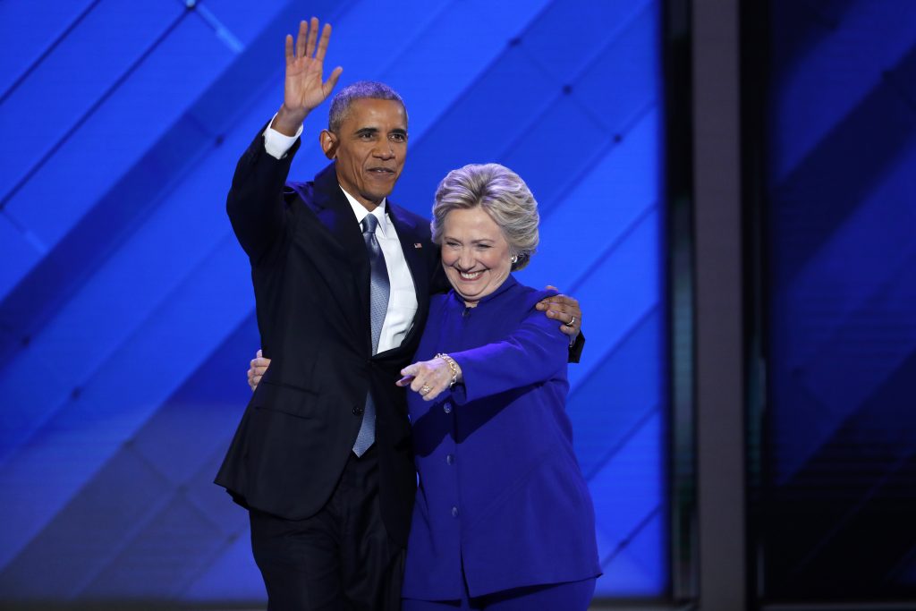 President Barack Obama and Democratic presidential nominee Hillary Clinton wave to delegates after she joined President Obama on stage during the third day of the Democratic National Convention in Philadelphia , Wednesday, July 27, 2016. (AP Photo/J. Scott Applewhite)