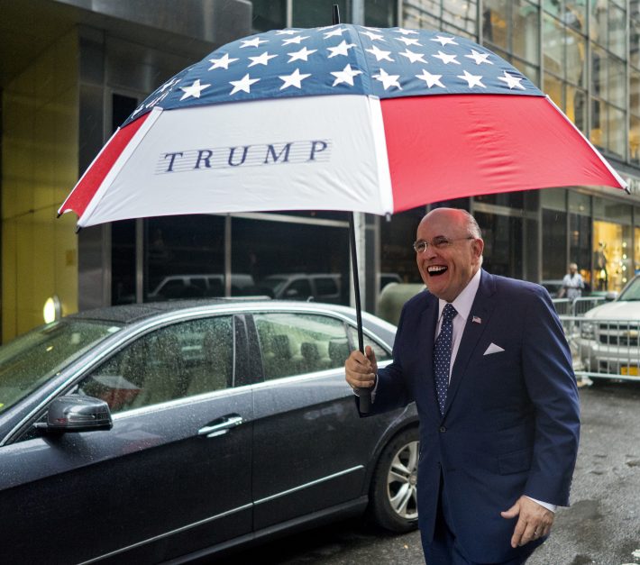 Former New York City mayor Rudy Giuliani leaves Trump Tower in New York on Sunday, Oct. 9, 2016. (AP Photo/Craig Ruttle)