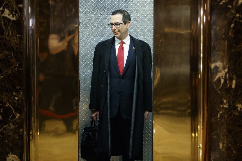 Steven Mnuchin, President-elect Donald Trump's nominee for Treasury Secretary, gets on an elevator after speaking with reporters in the lobby of Trump Tower, Wednesday, Nov. 30, 2016, in New York. (AP Photo/Evan Vucci)