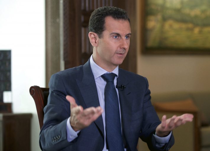 FILE - In this Wednesday, Sept. 21, 2016 photo released by the Syrian Presidency, Syrian President Bashar Assad speaks to The Associated Press at the presidential palace in Damascus, Syria. The House on Nov. 15, overwhelmingly approved bipartisan bills to crack down on supporters of Syrian President Bashar Assad’s government and renew a decades-old Iran sanctions law. Swift passage underscored broad support on Capitol Hill for punishing financial backers of the Syrian government and maintaining economic pressure on Tehran.(Syrian Presidency via AP)