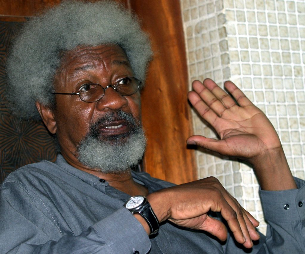 Nobel literature laureate Wole Soyinka speaks to the media during an interview at his home in Abeokuta, 80 km (50 miles) north of the capital Lagos, Nigeria, July 8,2004. Soyinka said oil exporter Nigeria is heading for a violent implosion that would dwarf the crisis in Sudan's Darfur region and added a wave of mass killings in May this year was just a precursor to the balkanization of Africa's most populous nation, as rival ethnic and religious groups vie for dominance. REUTERS/George Ersiri