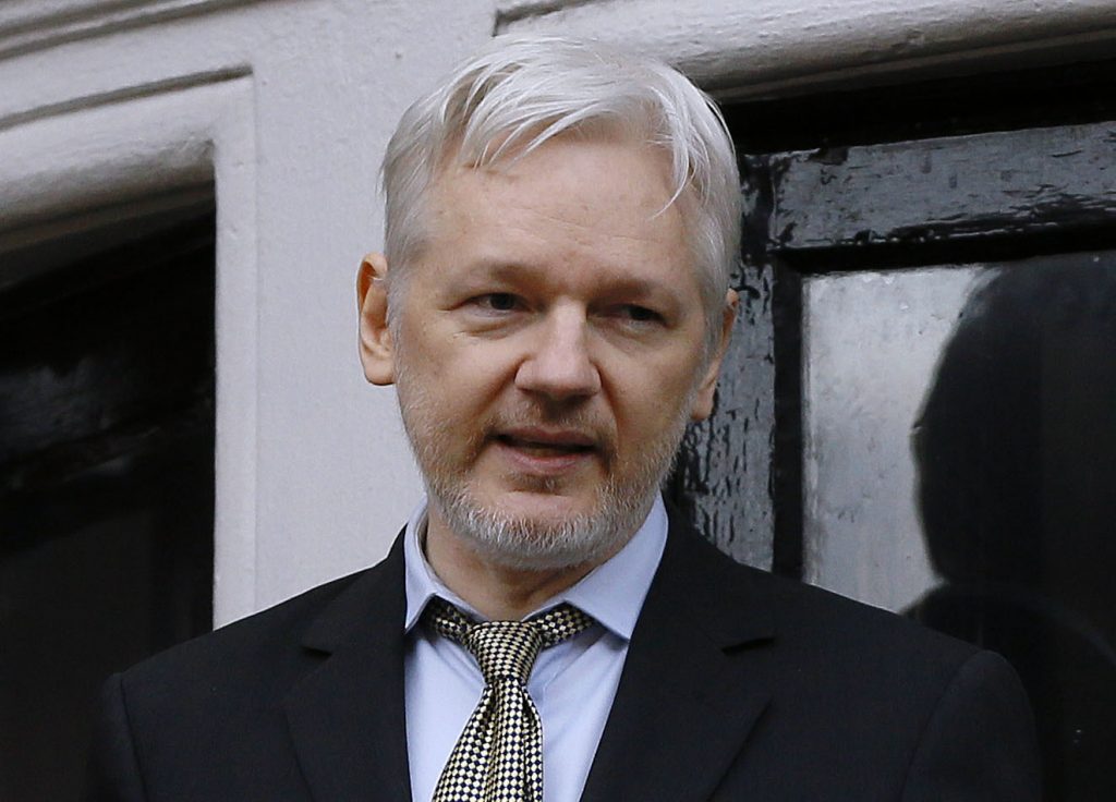 FILE - In this Friday Feb. 5, 2016 file photo, Wikileaks founder Julian Assange speaks from the balcony of the Ecuadorean Embassy in London. Assange will be interviewed by Fox News Channel's Sean Hannity on 