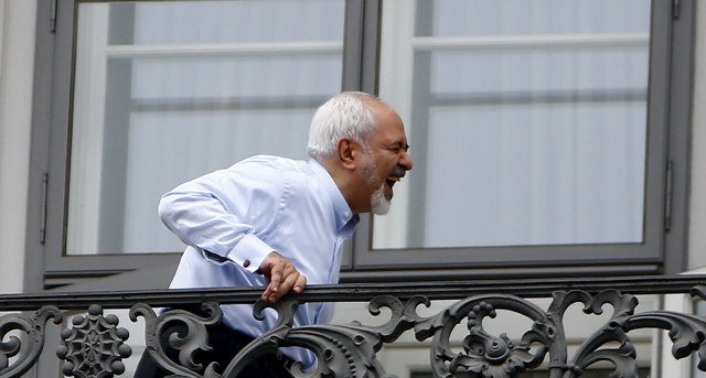 Iranian Foreign Minister Zarif stands on the balcony of Palais Coburg, the venue for nuclear talks, in Vienna
