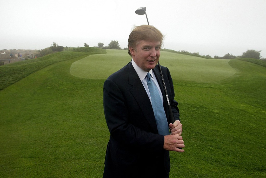 FILE - In this Nov. 9, 2002 file photo, Donald Trump holds a driver on the 11th green of his Ocean Trails Golf Club in Rancho Palos Verdes. Trump?s been telling Americans for nearly three decades that he?s what they really need in the White House, a business-hardened dealmaker-in-chief. Now that he?s actually running for president, Trump gets to say it Thursday night from center stage and in prime-time as the top-polling candidate in the first Republican presidential debate of the 2016 campaign. (AP Photo/Damian Dovarganes, File)