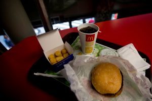 A Quarter Pounder meal is served with arepas or corn cakes at a local McDonald's, in Caracas, Venezuela, Tuesday, Jan. 6, 2015. McDonald?s franchises in Venezuela have run out of potatoes and are now serving South American alternatives like deep-fried arepas or yuca, a starchy tuberous root. The franchisers are blaming a contract dispute with West Coast dock workers for halting the export of frozen fries to the country. (AP Photo/Fernando Llano)