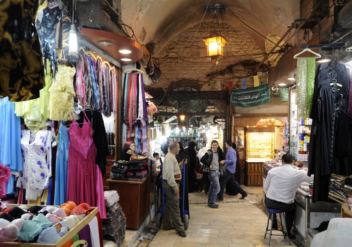 Vendors sell their wares at the Al-Madina Souq market in Aleppo in this March 3, 2011 file photo. Hundreds of shops were burning in the ancient covered market in Aleppo on September 29, 2012 as fighting between rebels and state forces in Syria's largest city threatened to destroy a UNESCO world heritage site. Aleppo's Old City is one of several locations in Syria declared world heritage sites by UNESCO, the United Nations cultural agency, that are now at risk from the fighting. Picture taken March 3, 2011. REUTERS/Fabian Bimmer/Files (SYRIATRAVEL UNREST - Tags: CIVIL UNREST TRAVEL)